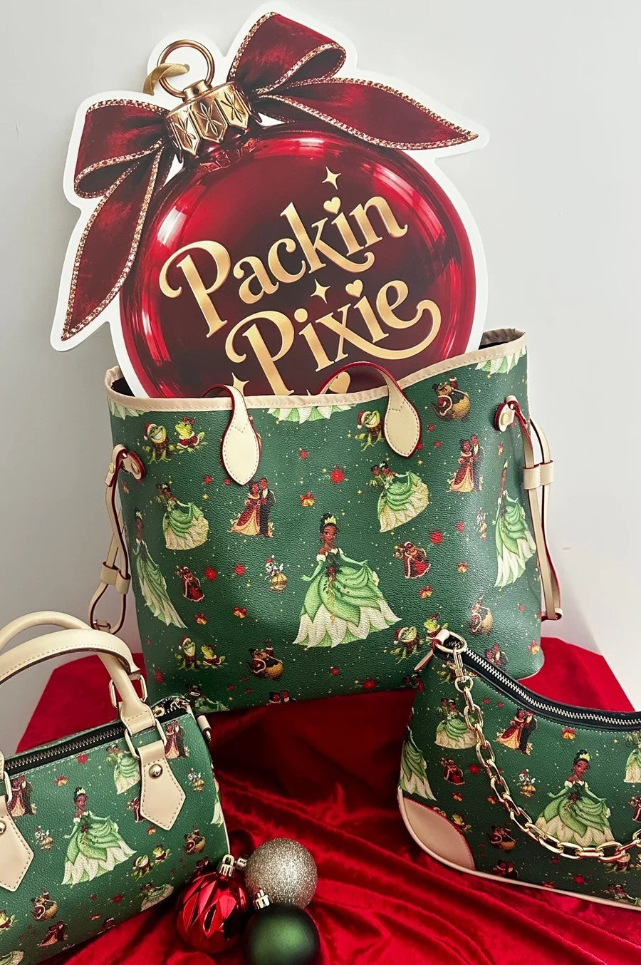 Christmas In the Bayou Tote Bag with the matching Duffle and Chain Bags beside the Packin Pixie ornament